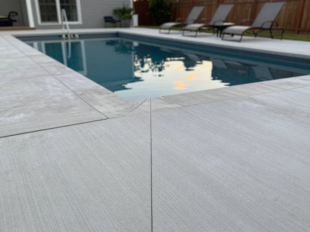 Textured concrete pool deck surround in Madison, AL